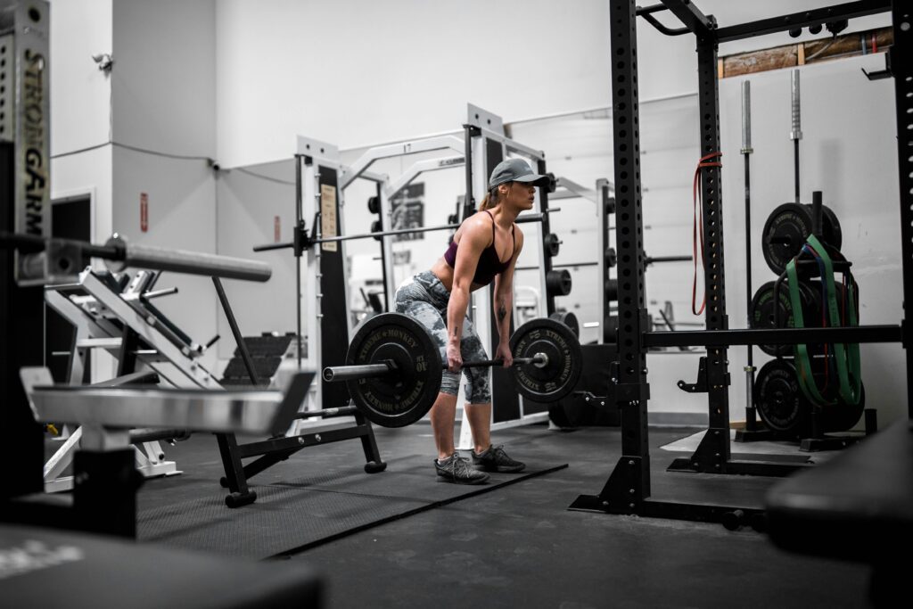 runner performing deadlift in the gym